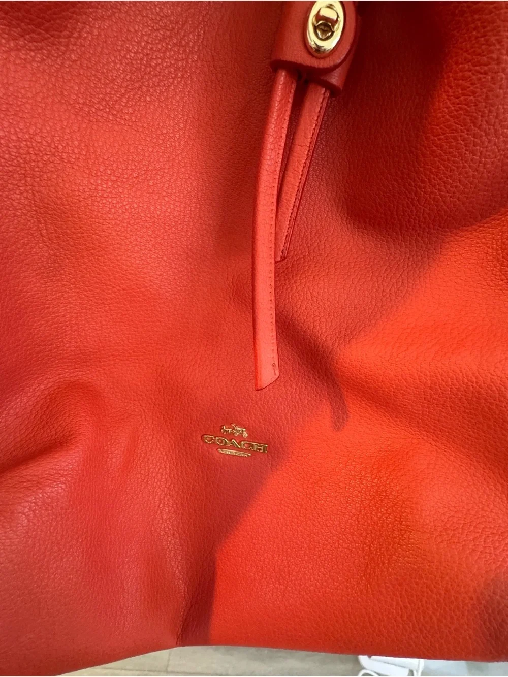 Coach Twist Lock Coral-Orange Pebbled Leather Drawstring Shoulder Bag